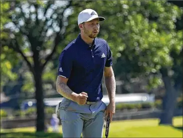  ?? DAVID J. PHILLIP / ASSOCIATED PRESS ?? Tournament winner Daniel Berger exults after his birdie putt on the 18th hole during Sunday’s final round of the Charles Schwab Challenge at Colonial Country Club in Fort Worth, Texas. He closed with a 4-under 66.