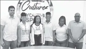  ?? ?? Dream realised! Minister of Culture, Youth and Sport Charles Ramson Jr (1st from left), and Director of Sport (1st from right) posing alongside national and scholarshi­p awardees and national athletes, Adriel Austin (3rd from left) and Anisha Gibbons (3rd from right). Also in the photo is Linda Johnny, mother of Gibbons (2nd from right) and Austin’s mother Joylyn Beaton