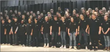  ?? The Sentinel-Record/Richard Rasmussen ?? SOUNDS OF FREEDOM: Seventh-grade students in the Lakeside Middle School Choir perform patriotic songs for a group of guests, including numerous veterans, at the school Monday as part of the school’s annual Veterans Day program.