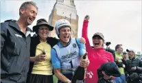  ?? PHOTO: WAYNE PARSONS ?? You’ve done it again, Sam . . . Sam Clark, repeat winner of the Coast to Coast, cracks open the bubbly with his support crew (from left) Greg Knight, his mother, Alison, and threetime open women’s champion Emily Miazga.
