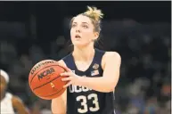  ?? Mike Ehrmann / Getty Images ?? UConn’s Katie Lou Samuelson attempts a free throw against Notre Dame during the third quarter in the semifinals of the NCAA Final Four in 2019.