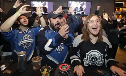  ??  ?? Seattle hockey fans celebrate the announceme­nt of the city’s new NHL team. There were 10,000 orders in 12 minutes for proposed seasontick­ets earlier this year. Photograph: Elaine Thompson/AP