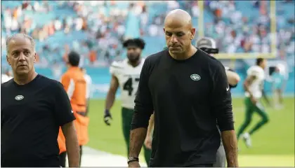  ?? LYNNE SLADKY — THE ASSOCIATED PRESS ?? Jets head coach Robert Saleh leaves the field at the end of a loss to the Miami Dolphins on Sunday.