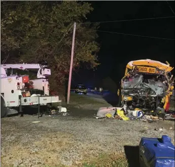  ?? TENNESSEE HIGHWAY PATROL VIA AP ?? This photo provided by the Tennessee Highway Patrol shows the scene of deadly crash involving a utility vehicle and a school bus carrying children on on Tuesday evening, in Decatur, Tenn.