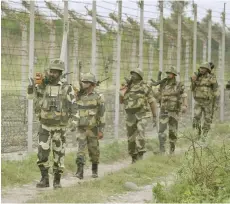  ??  ?? Indian soldiers patrolling near the Line of Control.