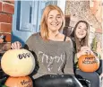  ??  ?? Fiona Simpson, prepares a pumpkin trail with her daughter, Erin, 14