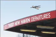  ?? Hearst Connecticu­t Media file photo ?? A U.S. Airways Express flight takes off for Philadelph­ia from Tweed New Haven Regional Airport.