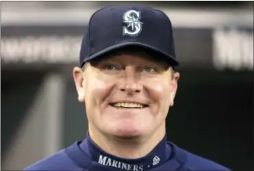  ?? ELAINE THOMPSON — THE ASSOCIATED PRESS FILE ?? Then-Seattle Mariners manager Eric Wedge smiles before a 2013 game against the Royals in Seattle. Former Cleveland and Seattle manager Eric Wedge has become the second person to interview with the New York Yankees for their dugout opening.