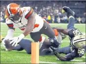  ?? BUTCH DILL — THE ASSOCIATED PRESS ?? Carlos Hyde dives into the end zone to give the Browns 12-3 lead, but the advantage didn’t last long in a 21-18 loss.