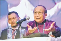  ??  ?? Rais (right) delivering his speech during the convention. — Bernama photo