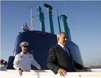  ??  ?? Prime Minister Benjamin Netanyahu walks on the Germanmade Israeli submarine Rahav in January 2016.