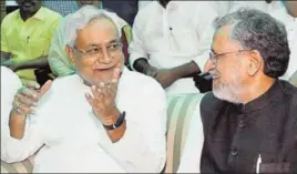  ?? SANTOSH KUMAR/HT PHOTO ?? Bihar chief minister Nitish Kumar talks to deputy chief minister Sushil Kumar Modi during the oath ceremony at Raj Bhawan in Patna on Thursday.