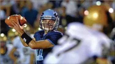  ?? For Montgomery Media / MARK C. PSORAS ?? North Penn quarterbac­k Austin Shearer looks for a receiver during Friday’s non-league, season-opener against La Salle