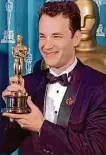  ?? Timothy Clary/AFP/Getty Images 1994 ?? Tom Hanks poses with his Oscar after winning the award for best actor for his performanc­e in the 1993 movie “Philadelph­ia.”