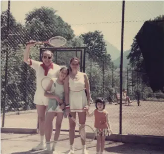  ??  ?? ABOVE: The Holzer family on the tennis court during a holiday in Austria in the mid-1970s. Left-right: Hans, Alexandra’s older sister Nadine, Catherine, and Alexandra.