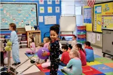  ?? (The Sentinel-Record/ Lance Brownfield) ?? A happy kindergart­en student at Cutter Morning Star Elementary School holds a bouncy ball Wednesday in class.