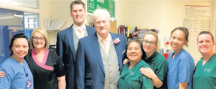  ??  ?? Ward five patient Lindsay Griffiths, centre, was able to get to his wedding thanks to staff members and his son and best man Darryl