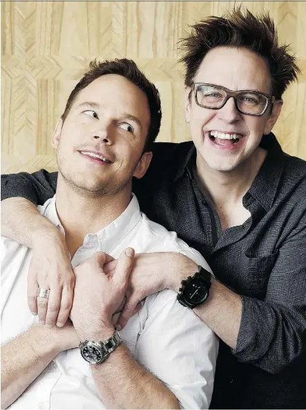  ?? CHRIS PIZZELLO/THE ASSOCIATED PRESS ?? Chris Pratt, left, star of Guardians of the Galaxy Vol. 2, is embraced by the film’s director, James Gunn, who jokes the studio insisted on a “beefcake clause.” The film opens Friday.