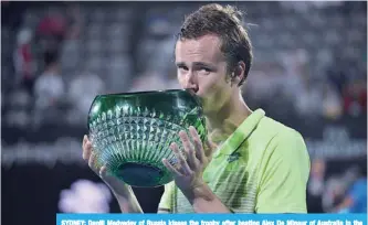  ?? —AFP ?? SYDNEY: Daniil Medvedev of Russia kisses the trophy after beating Alex De Minaur of Australia in the men’s singles final at the Sydney Internatio­nal tennis tournament in Sydney yesterday.