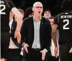  ?? Bebeto Matthews/Associated Press ?? UConn head coach Dan Hurley, center, reacts during the second half against St. John’s on Saturday.