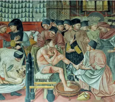  ?? ?? Cura degli ammalati (1440-1441), un affresco di Domenico di Bartolo, Pellegrina­io di Santa Maria della Scala, Siena