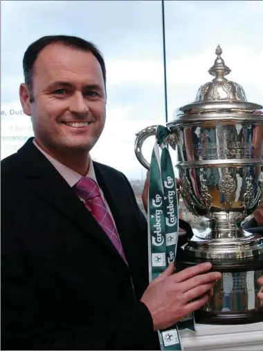  ??  ?? Paul Doolin with his Longford Town counterpar­t Alan Mathews ahead of the FAI Carlsberg Cup semi-final in 2004, beaten after a replay, but 12 months on they went all the way in that competitio­n for the first time in their history.