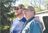  ??  ?? Ted Caldwell, right, and his son Garnet Caldwell stand in the Tennessee River Garden property.