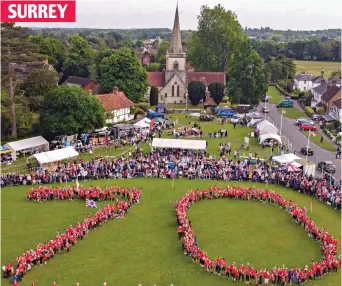  ?? ?? SURREY
Wonder of the age: Brockham residents – on hobby horses – spell out 70