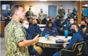  ?? SEAMAN MASON CONGLETON U.S. NAVY ?? Adm. John Aquilino speaks with sailors on the aircraft carrier Carl Vinson this week.