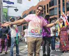  ?? JON WILLING ?? Fred Morsy, 29, of Ottawa celebrates his first Pride parade on Sunday after coming out three months ago.