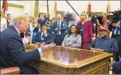  ?? Michael Reynolds EPA/Shuttersto­ck ?? KANYE WEST participat­es with others in an Oval Office meeting with President Trump on Thursday.