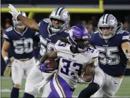  ?? MICHAEL AINSWORTH - THE ASSOCIATED PRESS ?? FILE - In this Nov. 10, 2019, file photo, Minnesota Vikings running back Dalvin Cook (33) runs the ball as Dallas Cowboys’ Robert Quinn (58) and Leighton Vander Esch (55) give chase during the first half of an NFL football game in Arlington, Texas. Cook is in position to win his first NFL rushing title after two injury-plagued seasons, which could also help him in the AP MVP voting.