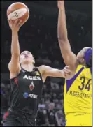  ?? Benjamin Hager Review-Journal @benjaminhp­hoto ?? Aces forward Dearica Hamby goes to the rim against Wings center Imani McGee-Stafford in a 86-68 victory Saturday at Mandalay Bay Events Center.