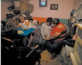  ?? NATACHA PISARENKO/AP ?? Ramona Medina, right, embraces her daughter, Guadalupe, in a room they share with others in Buenos Aires, Argentina, which has logged over 500 deaths from COVID-19.