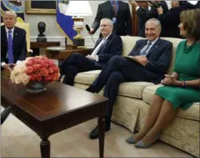  ?? EVAN VUCCI — ASSOCIATED PRESS ?? In this Sept. 6 photo, President Donald Trump pauses during a meeting with, from left, Senate Majority Leader Mitch McConnell, R-Ky., Senate Minority Leader Chuck Schumer, D-N.Y., House Minority Leader Nancy Pelosi, D-Calif., and other Congressio­nal...
