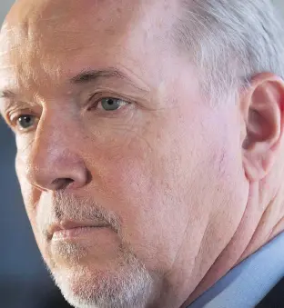  ?? THE CANADIAN PRESS/ FILES ?? Shame on Premier John Horgan for reviving a tax that was proposed in 1993 and dropped by a previous NDP government, says Stephen Wiseman.