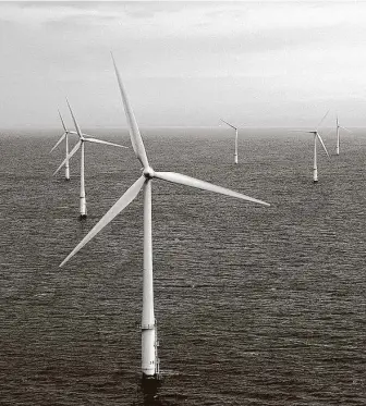 ?? Associated Press file photo ?? Wind turbines off the coast of Wales are shown in 2004. Offshore wind, which has been an industry for only about three decades, now is in the mainstream of large-scale power generation.