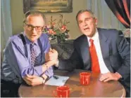  ?? AP PHOTO/JOHN RUSSELL ?? Then-Republican presidenti­al candidate Texas Gov. George W. Bush jokes with CNN’s Larry King after finishing the “Larry King Live” show in Nashville in 1999. King died Saturday morning at Cedars-Sinai Medical Center in Los Angeles.