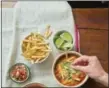  ?? TODD COLEMAN VIA AP ?? This July 2014 photo shows Mexican tortilla soup in New York. This dish is from a recipe by Katie Workman.