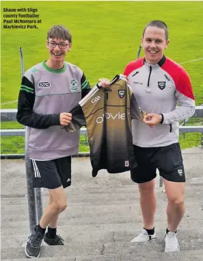  ?? ?? Shane with Sligo county footballer Paul McNamara at Markievicz Park.