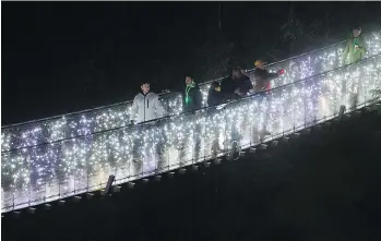  ?? GERRY KAHRMANN/PNG ?? The Capilano River suspension bridge is lit up during Canyon Lights in North Vancouver.