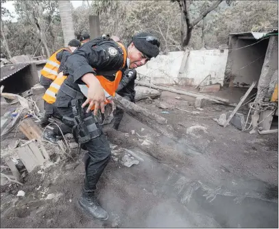  ?? Moisés Castillo ?? The Associated Press Police search Thursday for Edgar Otoniel Chavez, his wife Sandra and son Josue, who are missing in San Miguel Los Lotes, Guatemala.