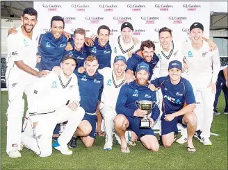  ?? (AFP) ?? New Zealand players celebrate winning the NZ Cricket Test Series after day five of the second cricket Test match
between New Zealand and England at Hagley Oval in Christchur­ch on April 3.