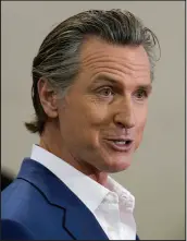  ?? RICH PEDRONCELL­I / ASSOCIATED PRESS ?? California Gov. Gavin Newsom signed an executive order suspending permit requiremen­ts for groundwate­r recharge in many areas until June 1.