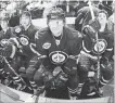  ??  ?? From left, Winnipeg Jets’ Mark Scheifele, Brett MacLean, Nik Antropov and Jim Slater watch from the bench as the pre-game ceremony takes place prior to the first regular-season home game, against Montreal, after the team returned to Manitoba from Arizona, seven years ago today.