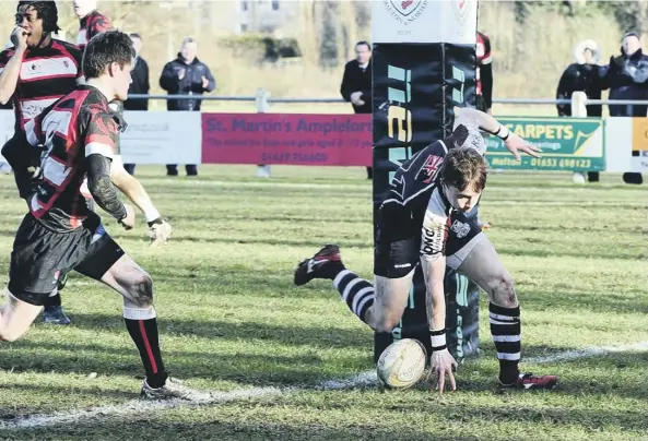  ??  ?? Scarboroug­h’s Jordan Wakeham touches downPictur­es by Andy Standing