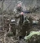  ?? UKRAINIAN PRESIDENTI­AL OFFICE VIA AP ?? In this frame grab from a video, a Ukrainian soldier smokes a cigarette before being shot. The 30th Mechanized Brigade says the man is Tymofii Shadura.