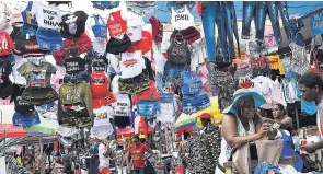  ??  ?? As Christmas shopping gets into high gear, vendors transforme­d Beckford Street into an arcade in downtown Kingston. The street is designated as a vending area for the festive season.