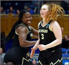  ?? KARL B. DEBLAKER — THE ASSOCIATED PRESS ?? Colorado’s Frida Formann, right, celebrates after a basket with teammate Aaronette Vonleh during the second half of their game in the second round of the NCAA Tournament against Duke on Monday in Durham, N.C.