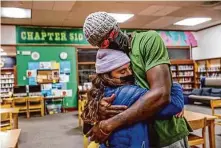  ?? Gabrielle Lurie/The Chronicle 2022 ?? Jacqueline Cashman (left) embraces friend Moses Omolade, who was on a hunger strike in opposition to the school closures.